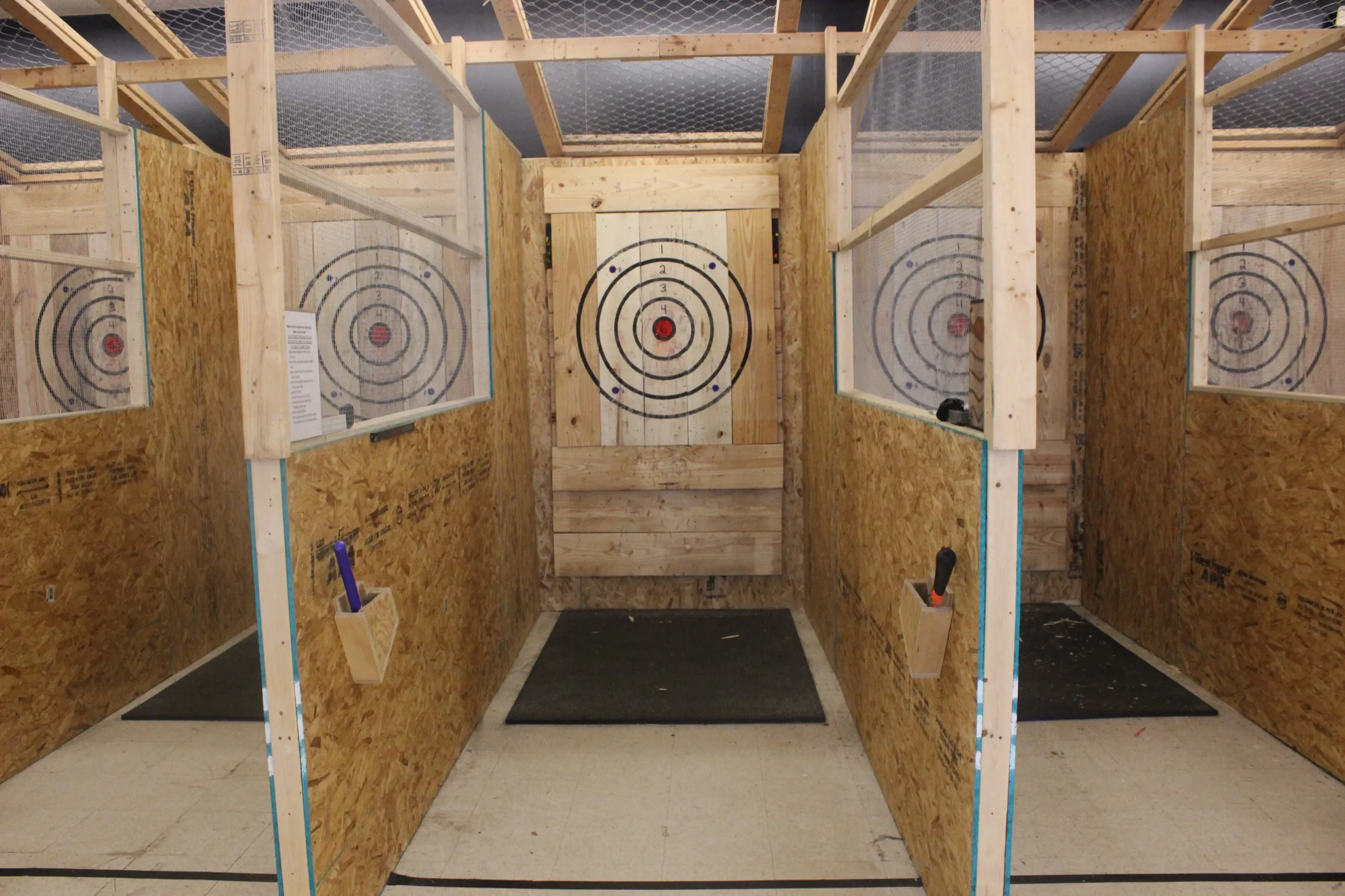 Axe stuck in the bullseye of a wooden target in Albany, GA