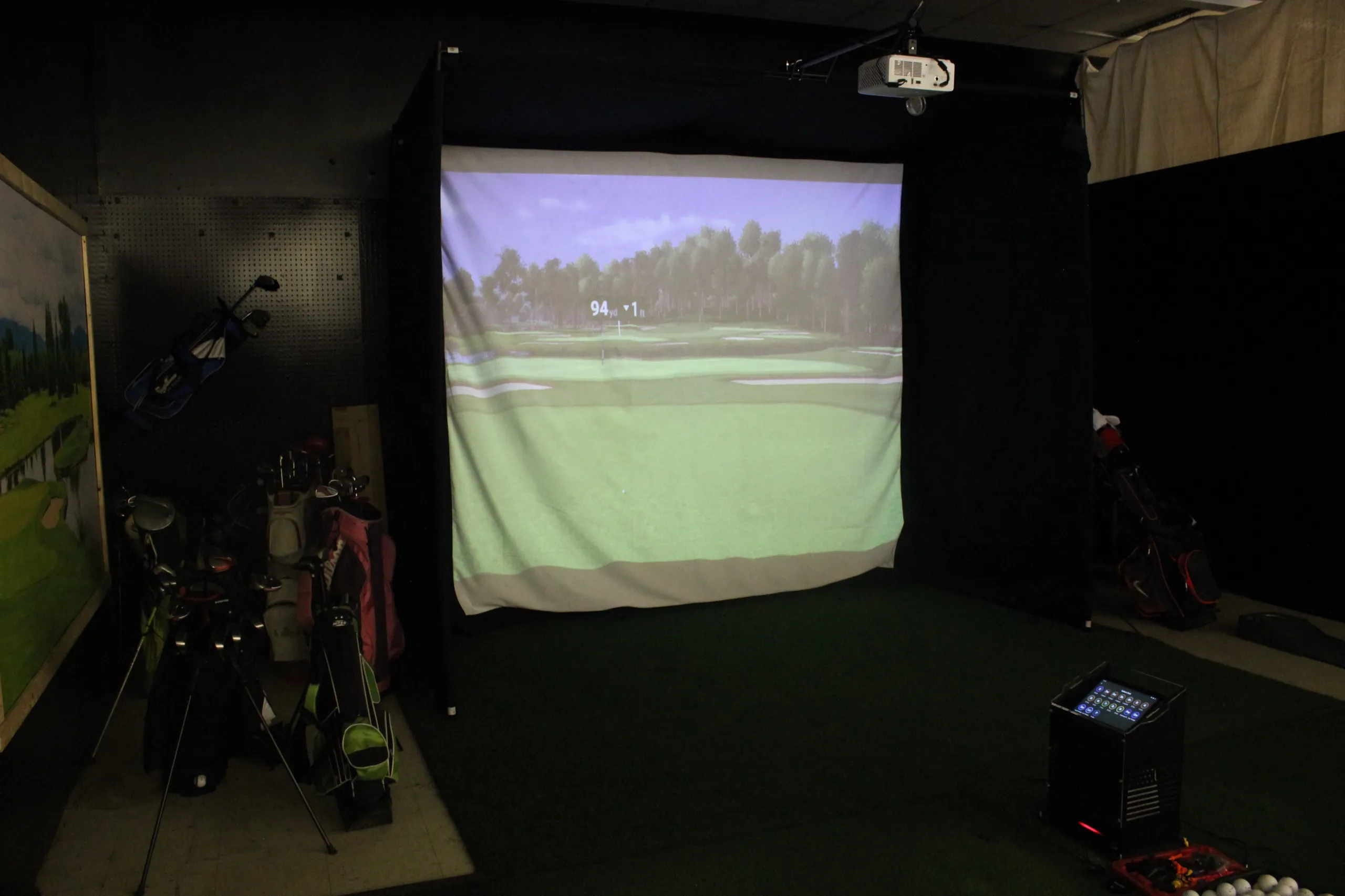 Golf simulator screen and hitting bay at Up 2 U Entertainment in Albany, GA