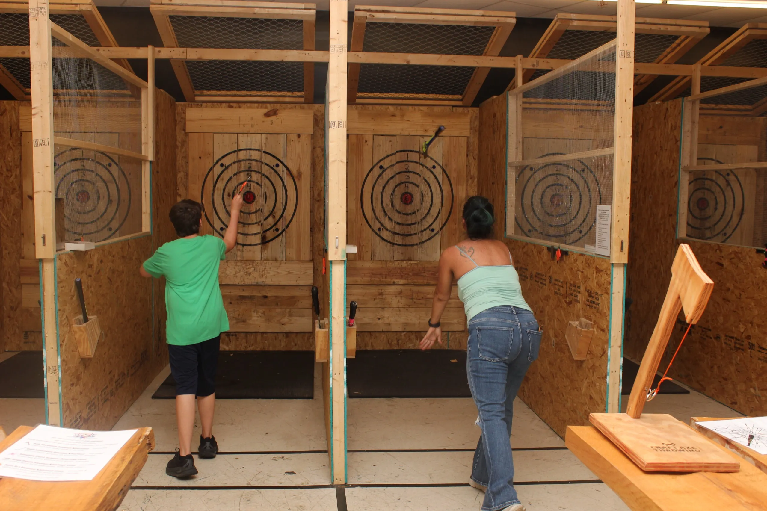 People throwing axes at the targets in Albany, GA